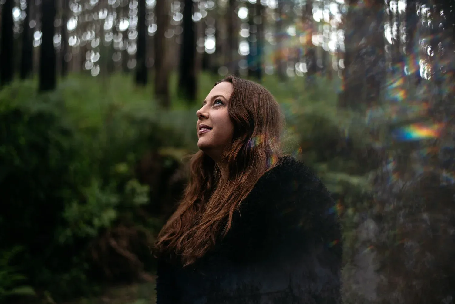 An outdoor portrait within a forest setting.