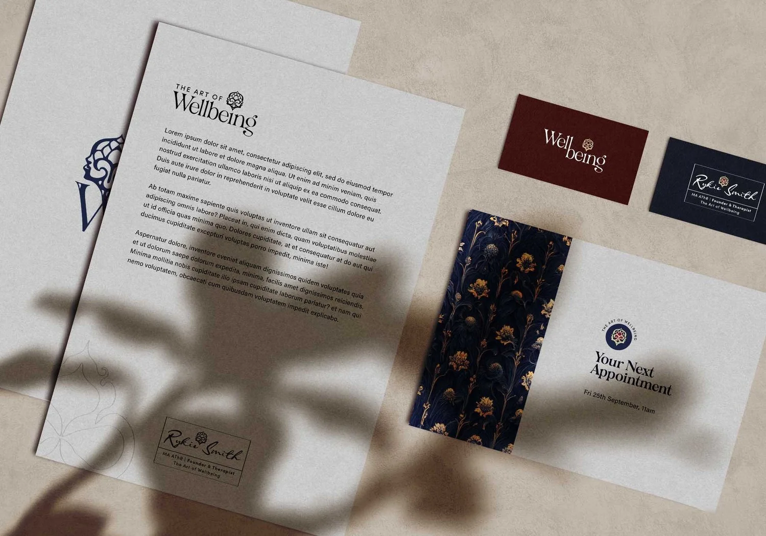 Cards and printed sheets from The Art of Wellbeing identity.