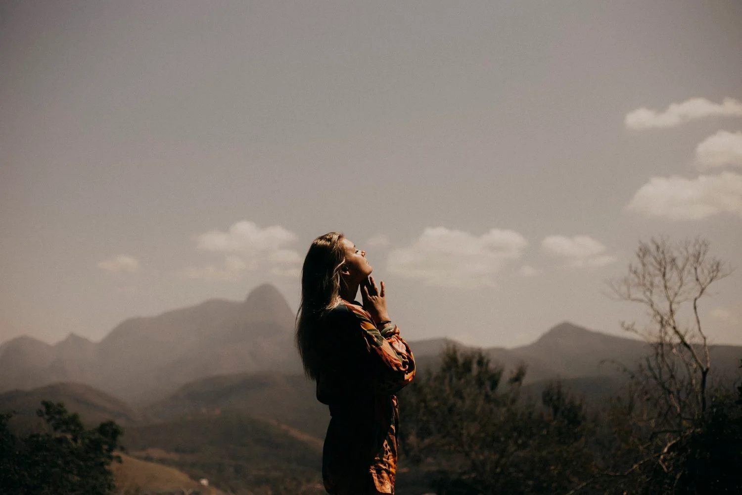 A figure beneath a broad sky in the Body Mind & You project imagery.